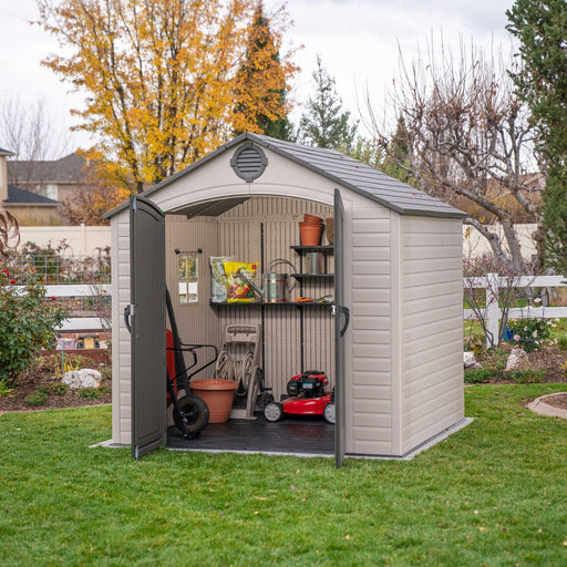 Front view of a storage shed featuring equipment inside