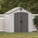 An angled view of a shed in a backyard.