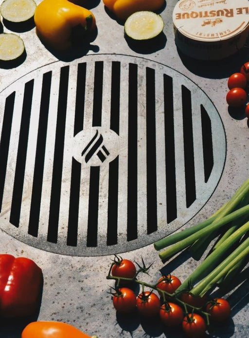 Fresh vegetables grilled on Arteflame grate, highlighting the grate's capacity for diverse grilling.