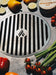 Fresh vegetables grilled on Arteflame grate, highlighting the grate's capacity for diverse grilling.
