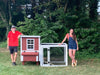 Customer-built OverEZ Chicken Coop In A Box, showcasing the red and white design with a side nesting box, providing a spacious area for chickens.