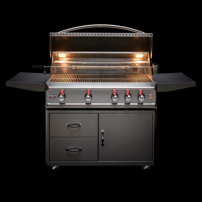 A Blaze Grills Professional LUX 3-4 Burner Built-In Gas Grill With Rear Infrared Burner by Blaze Grills with lights on.
