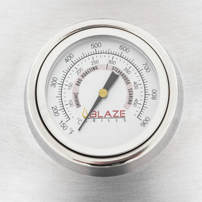 Close-up of the built-in thermometer on a Blaze Grills 20-inch Kamado Grill, with temperature readings in both Fahrenheit and Celsius.