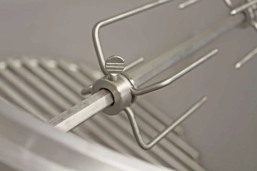 Close-up of the stainless steel rotisserie fork from the Blaze Grills 20-Inch Kamado Rotisserie Kit, highlighting the prongs and screw adjustment.