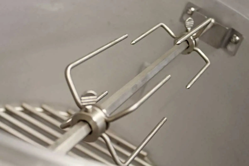 Detailed view of the rotisserie fork attached to the spit rod of the Blaze Grills 20-Inch Kamado Rotisserie Kit, emphasizing the secure fitting.
