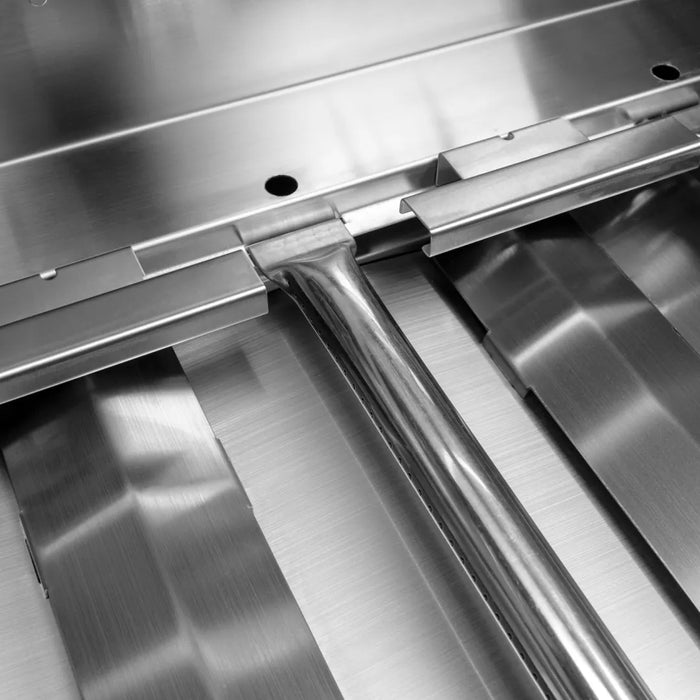 A close up of a Blaze Grills Prelude LBM 3-4 Burner Gas Grill stainless steel conveyor belt used in grills.