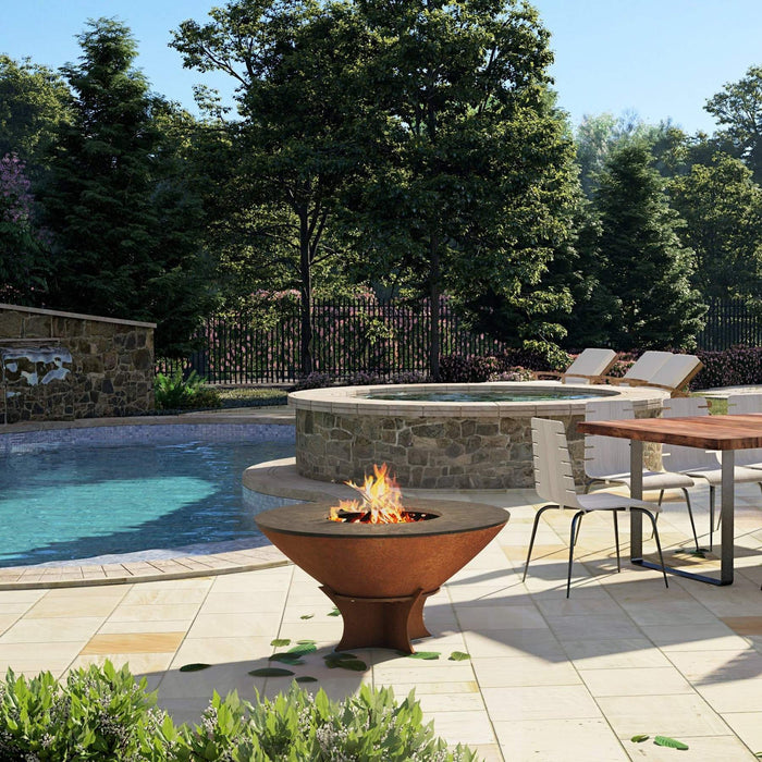 Arteflame Classic 40" Grill in an outdoor setting by the pool, demonstrating use as a fire bowl.