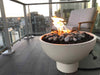 The Solus Decor Hemi Firebowl creating a cozy retreat on a compact city balcony, offering warmth and modern style.