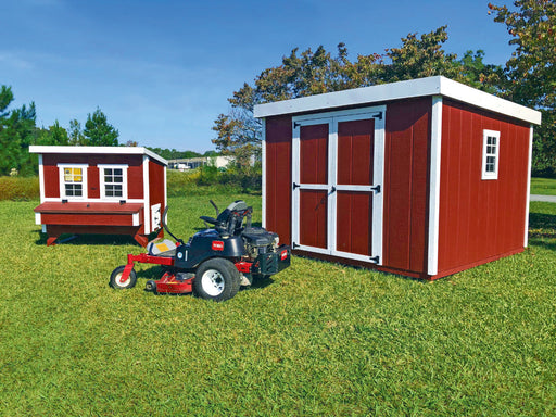 Full outdoor setup of the OverEZ Chicken Coop alongside the Shed Kit in a Box, with a lawn mower parked outside, showcasing practical usage.