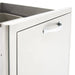An outdoor Blaze Grills Roll Out Double Trash/Recycle Drawer with a handle, perfect for outdoor clean-up or an outdoor kitchen.