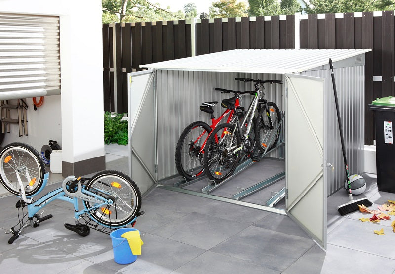 Duramax Bicycle Storage Shed Anthracite w/ White Trim - Backyard Oasis placed near garage with two bikes inside