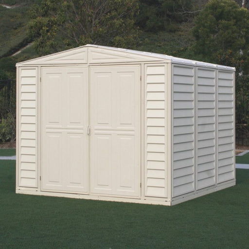 Duramax Duramate 8x8 Vinyl Shed w/ Foundation - Backyard Oasis in forest backdrop