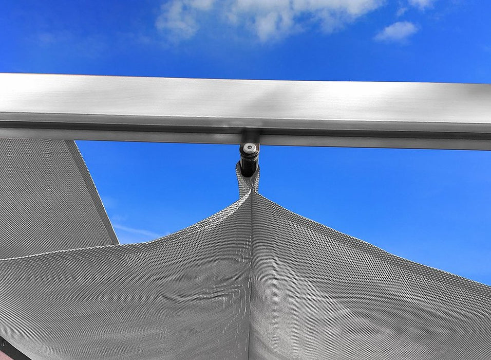 Close-up of the aluminum pergola showing the detail of the fabric canopy attachment.