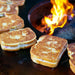 Grilled cheese sandwiches prepared on the Arteflame Classic 40" Grill, showcasing the cooktop's versatility.