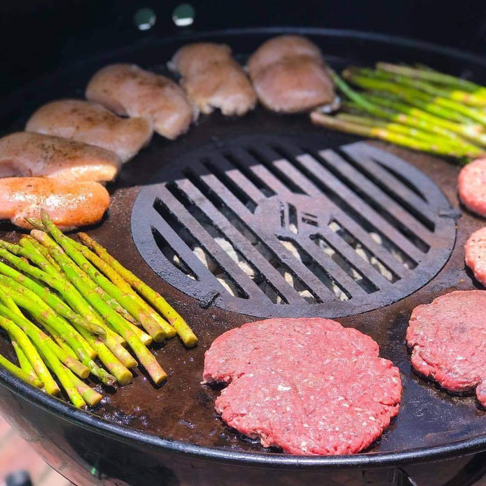 Juicy steaks and vegetables grilled on an Arteflame replacement grate in a Green Egg style grill.