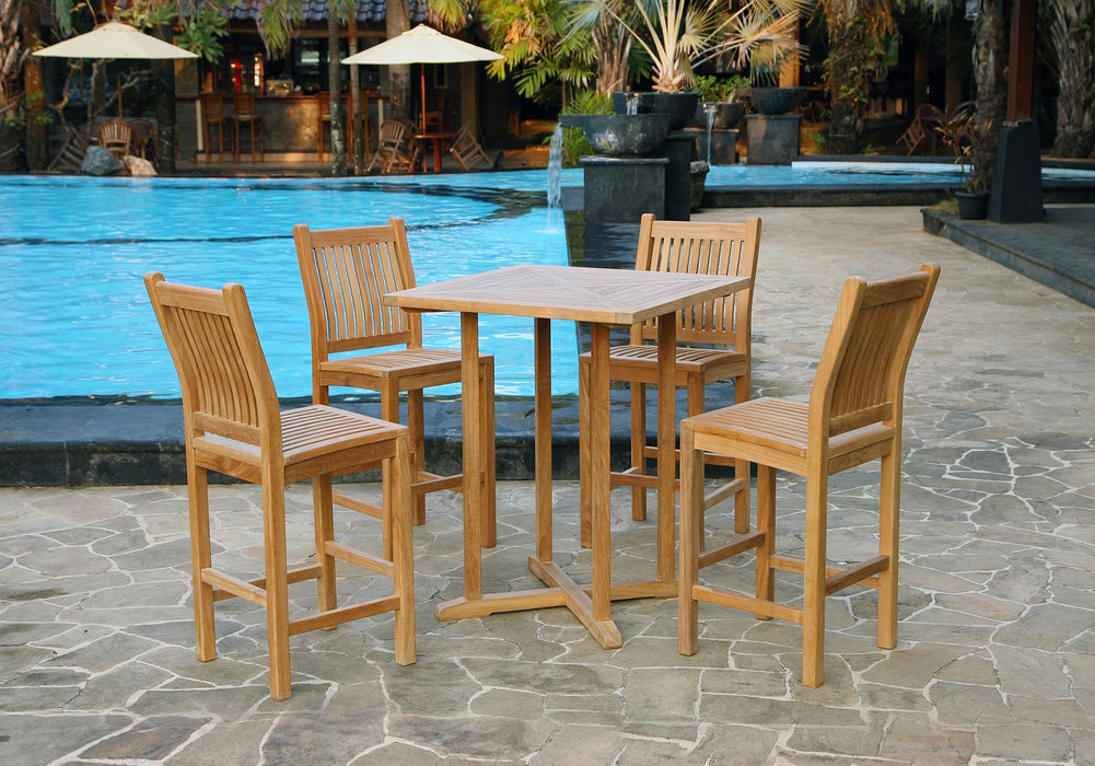 A durable Tortuga Outdoor Jakarta 5-Piece Teak Wood Bar Set by a pool.