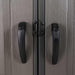 A close up of a Lifetime 11 Ft. X 11 Ft. Outdoor Storage Shed - 6433 door handle with black handles.