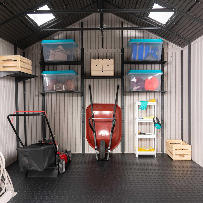A garage with a Lifetime 11 Ft. X 11 Ft. Outdoor Storage Shed - 6433 and other equipment.
