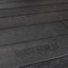 A close up of a black wood floor with a Lifetime 8 Ft. X 10 Ft. Outdoor Storage Shed - 60332 logo on it.