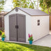 A Lifetime 8 Ft. X 15 Ft. Outdoor Storage Shed - 60075 in a backyard.