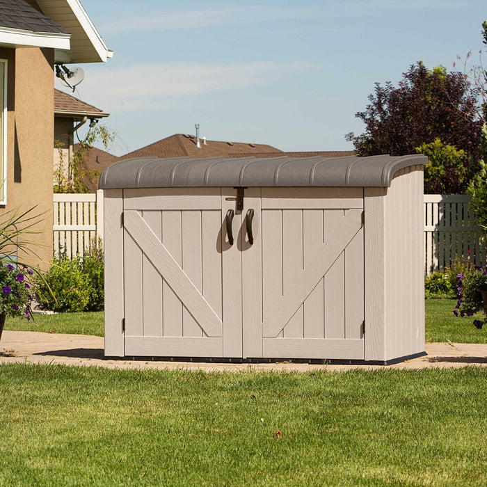 A Lifetime Horizontal Storage Shed (75 Cubic Feet) - 60170 in a yard.