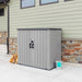 A Gray Lifetime Utility Shed - 60331U in front of a house.