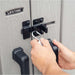 A person unlocking a Lifetime Utility Shed - 60331U garage door lock.