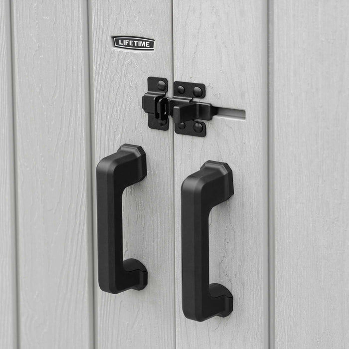 A pair of black handles on a white Lifetime Utility Shed - 60331U door.