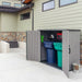 A Lifetime Utility Shed - 60331U with two trash cans on the side of a house.
