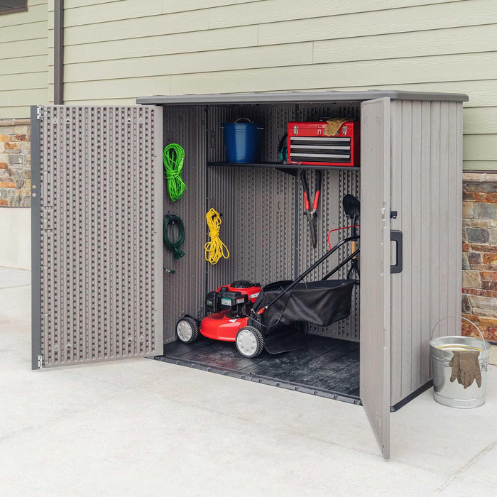A Lifetime Utility Shed - 60331U with a lawn mower and tools.