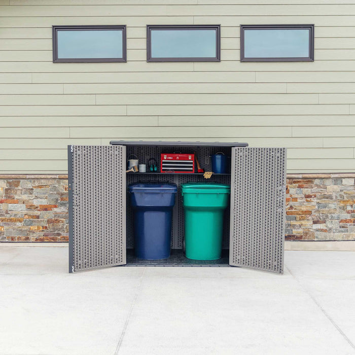A garage with two Lifetime Utility Sheds - 60331U and a Lifetime trash can.