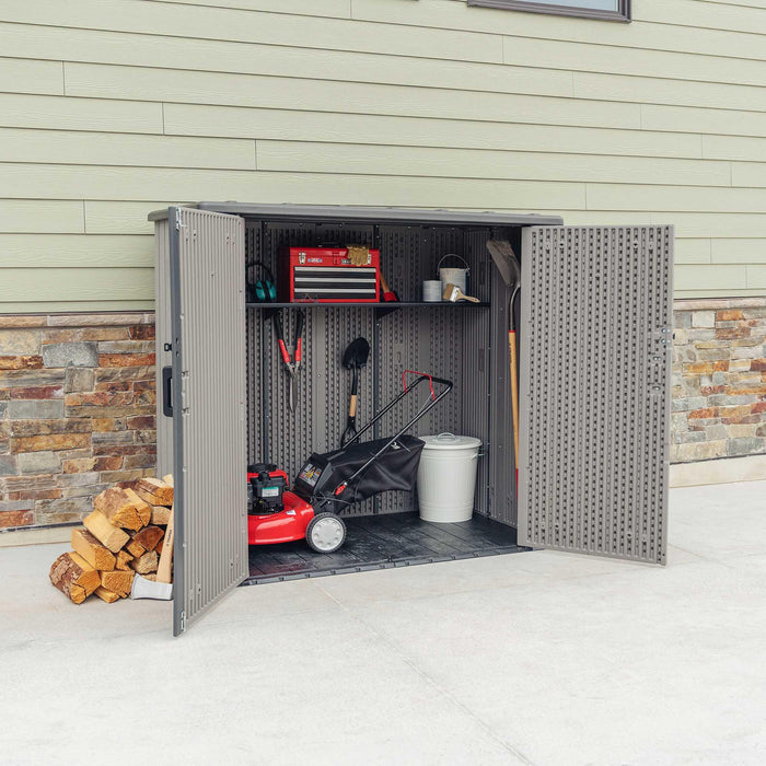 A Lifetime Utility Shed - 60331U with a lawnmower and tools.