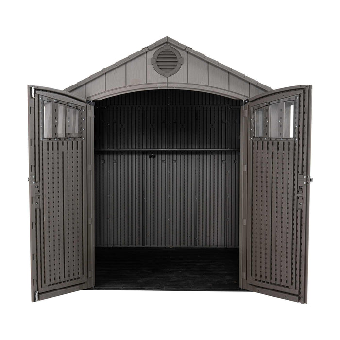 Front view of an empty storage shed featuring open doors on a white background.