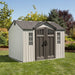 A gray and white Lifetime 10 Ft. X 8 Ft. Outdoor Storage Shed - 60243 on a green lawn.