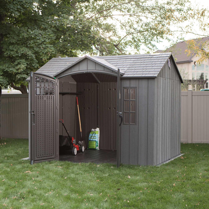 A Lifetime 10 Ft. X 8 Ft. Outdoor Storage Shed - 60330 in a yard.
