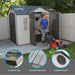 A man is mowing his lawn in front of a Lifetime 10 Ft. X 8 Ft. Outdoor Storage Shed - 60001.
