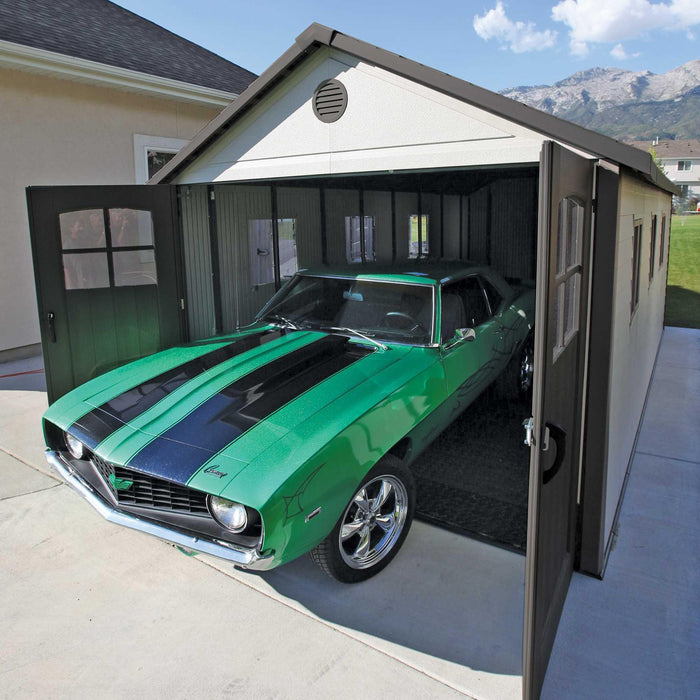 A green Lifetime 11 Ft. X 21 Ft. Outdoor Storage Shed - 60237 is parked in a garage.