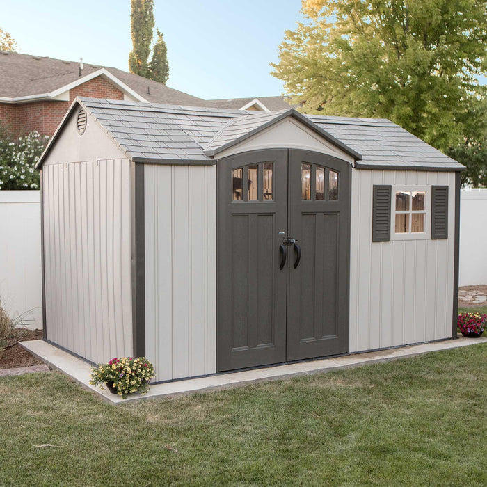 A Lifetime 12.5 Ft. X 8 Ft. Outdoor Storage Shed - 60223 in a backyard.