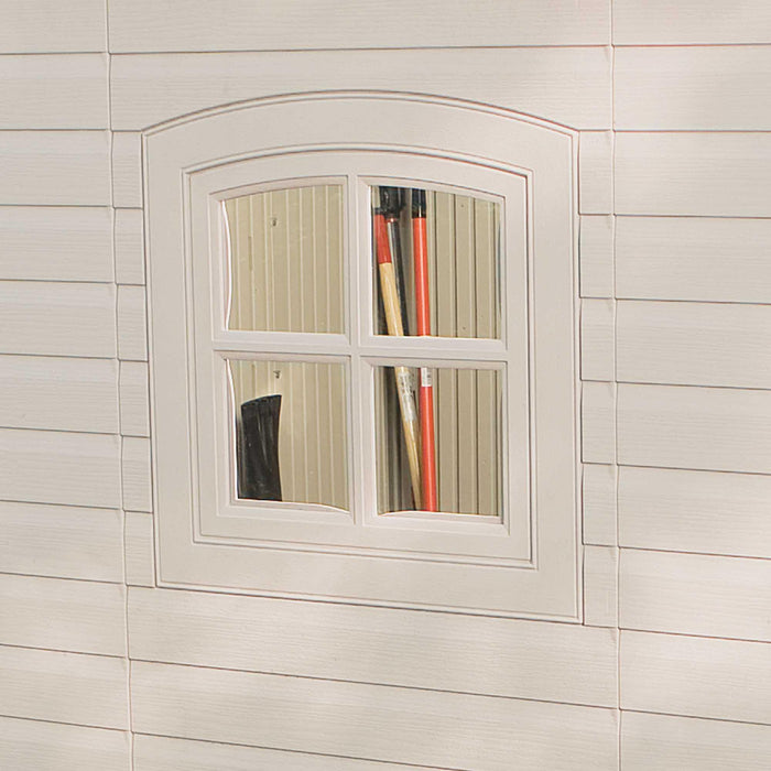 A window in a white house with a Lifetime 15 Ft. X 8 Ft. Outdoor Storage Shed - 60079 in it.