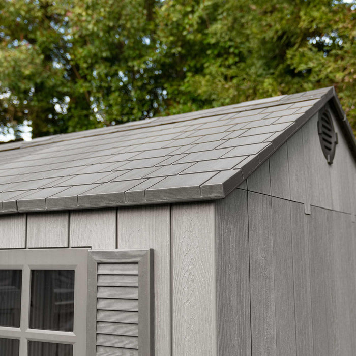 A Lifetime 15 Ft X 8 Ft Outdoor Storage Shed - 60318 with a grey roof and shutters.