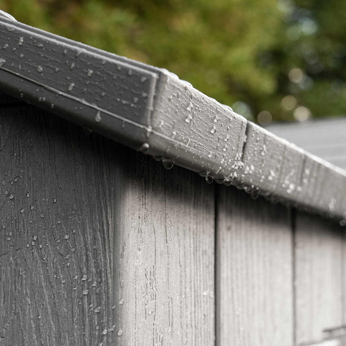 A close up of a Lifetime 15 Ft X 8 Ft Outdoor Storage Shed - 60318 with rain drops on it.