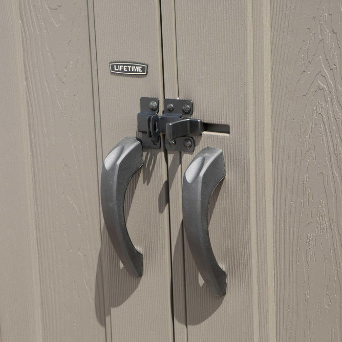 A closeup view of a pair of handles on a Lifetime 17.5 Ft. X 8 Ft. Outdoor Storage Shed - 60213 wooden door.