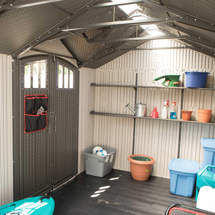 A different angle featuring an occupied interior of the Lifetime Outdoor Storage Shed 