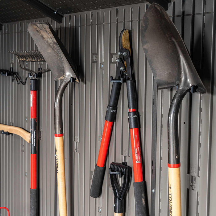 Equipment hung on the walls of a storage shed 