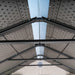 A view of the frames supporting the ceiling of a metal building