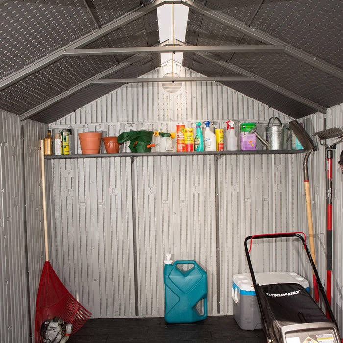 A Lifetime shed with a lawnmower and other tools.