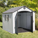 A Storage Shed with doors open in the yard.