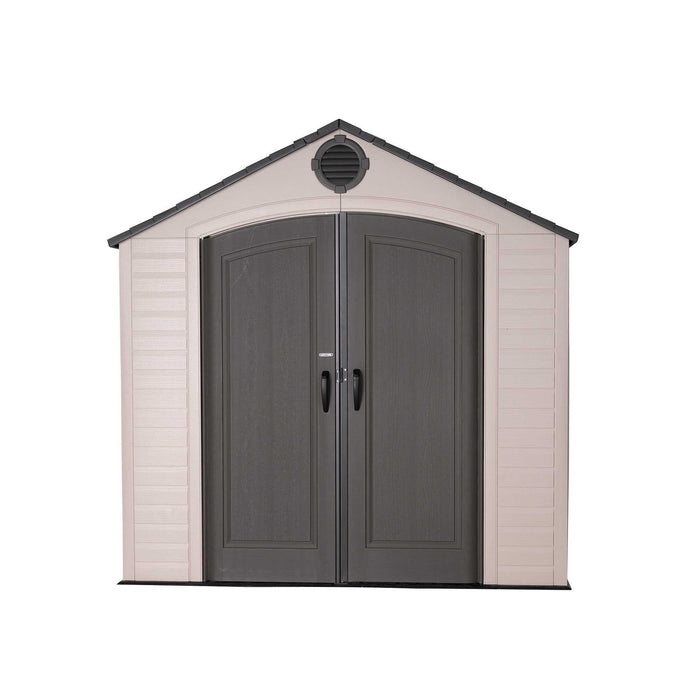 Front view of a storage shed featuring closed doors in a white background