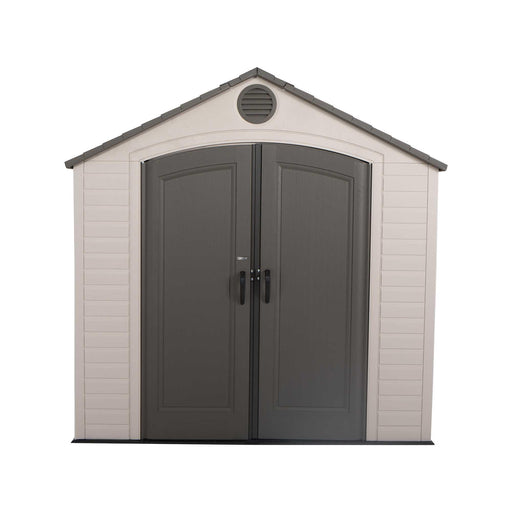Front view of a storage shed featuring closed doors on a white background