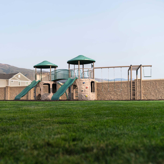 Full view of the Lifetime Double Adventure Tower With Monkey Bars in an outdoor grassy setting.